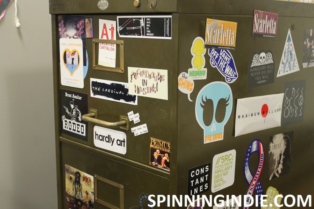 sticker-covered cabinet at Rainy Dawg radio