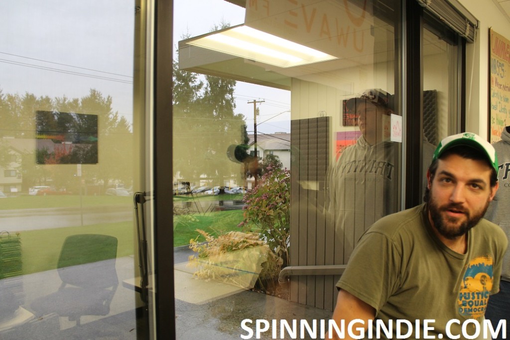 Justin McMahon in front of college radio station UWave's studio