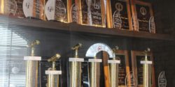 Trophy case at college radio station WONC, with plaques and trophies