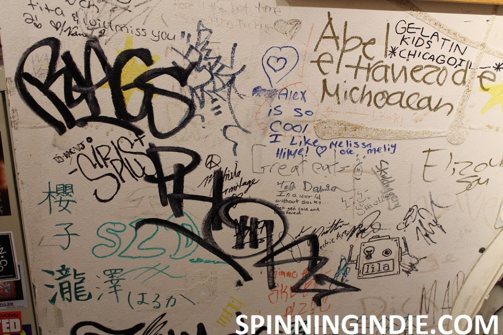 graffiti and signature-covered wall at KWVA