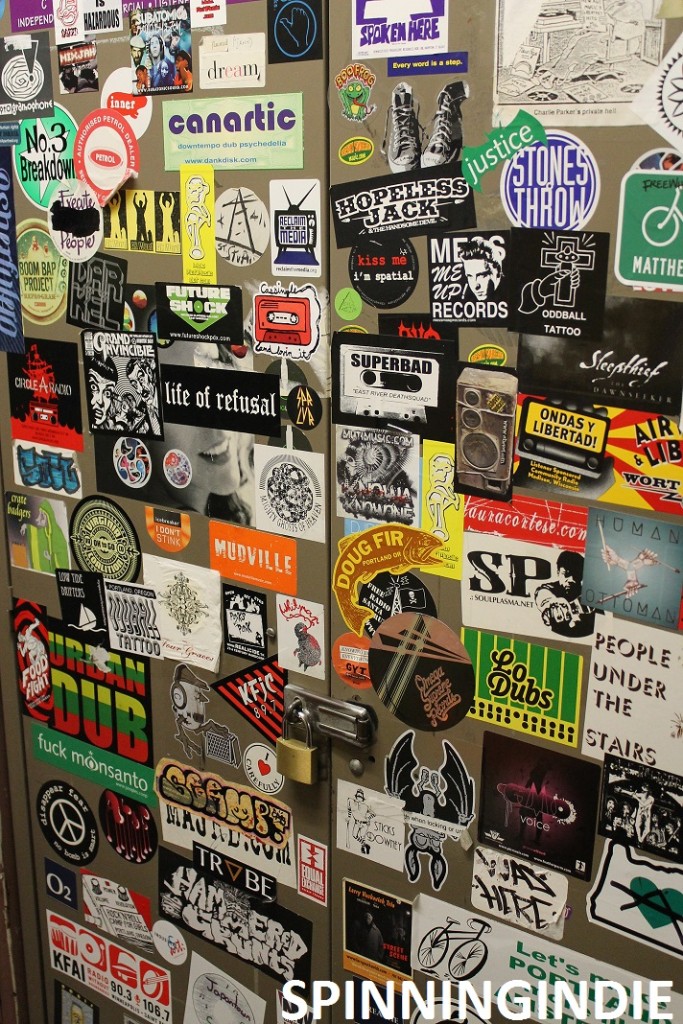 Sticker-covered cabinet at KBOO. Photo: J. Waits