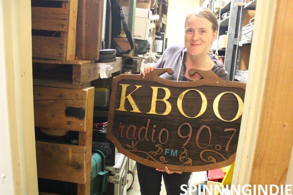 Becky Meier with KBOO sign. Photo: J. Waits