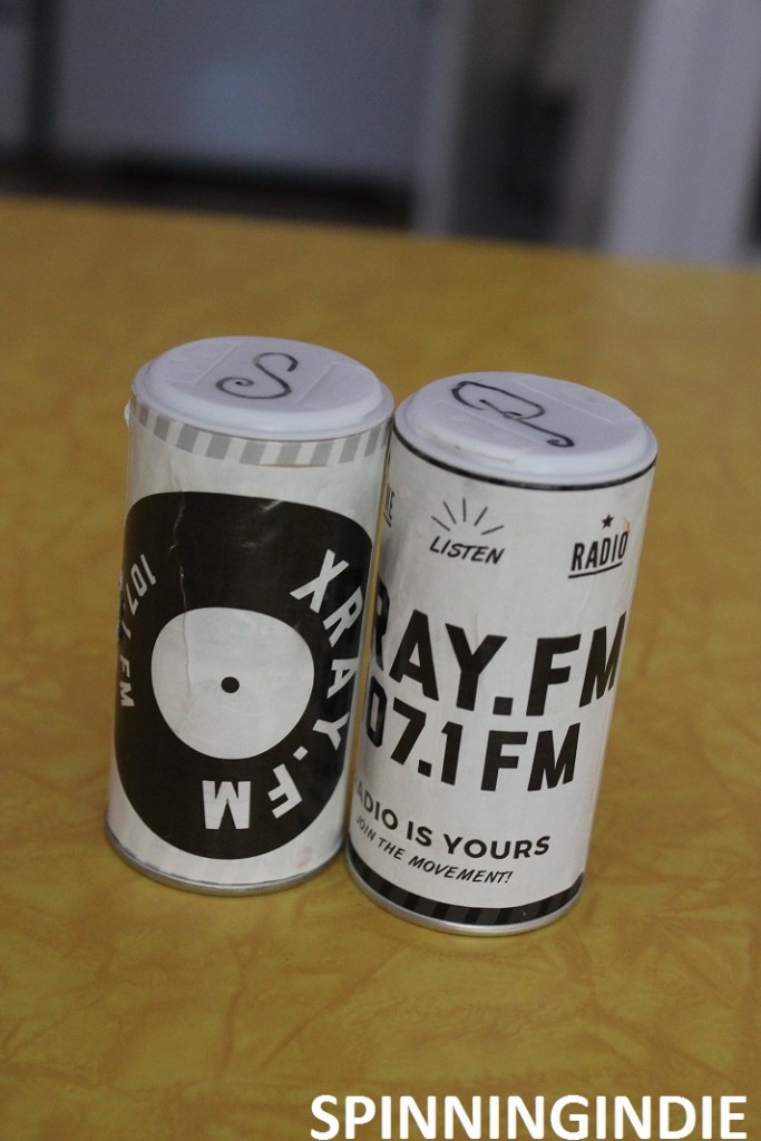 Sticker-plastered salt and pepper shakers at XRAY.fm. Photo: J. Waits