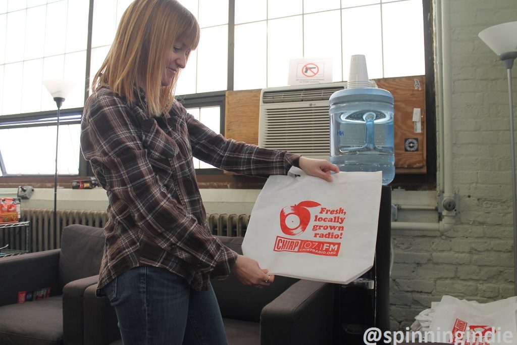 Shawn Campbell with CHIRP Radio tote bag. Photo: J. Waits