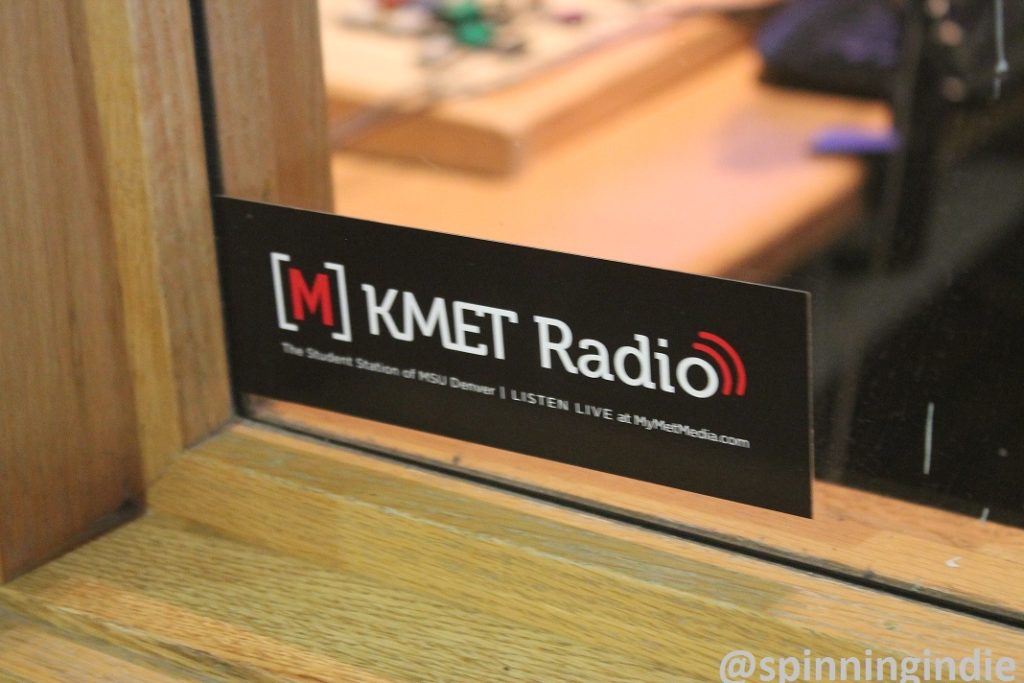 Met Radio sticker on window to college radio station booth. Photo: J. Waits