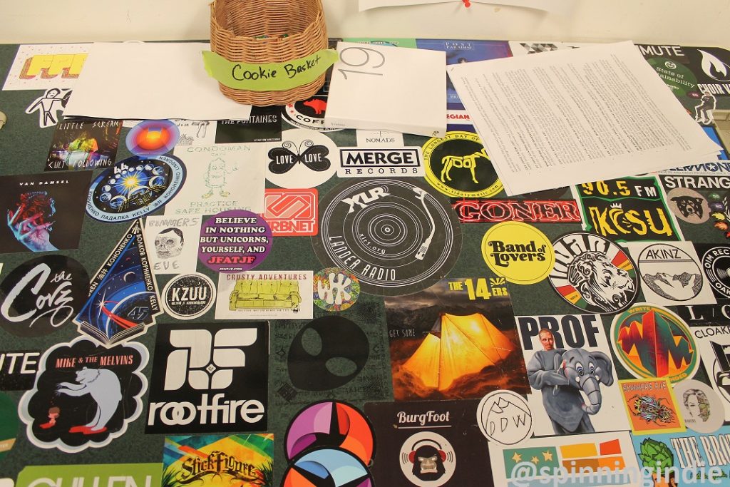 Sticker-covered desk at KCSU. Photo: J. Waits