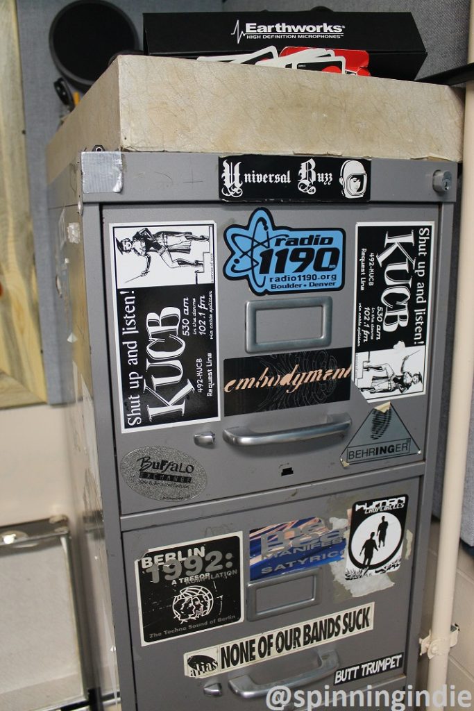 Old KUCB stickers at Radio 1190. Photo: J. Waits