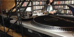 A glimpse through the turntables in the college radio station KUCI on-air studio. Photo: J. Waits