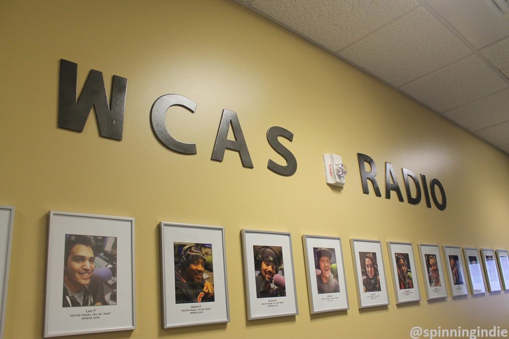 Hallway full of DJ and show host photos at WCAS Radio. Photo: J. Waits