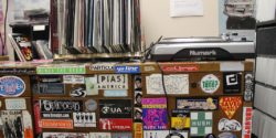 Turntable and vinyl records atop cabinet in college radio station KXUA's on-air studio. Photo: J. Waits