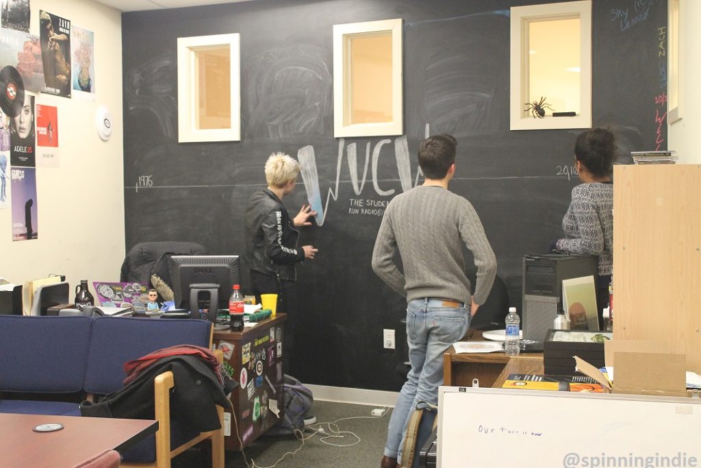 WVCW staffer draws a timeline on the chalk board while Alan Booth and Kiara Walker look on. Photo: J. Waits
