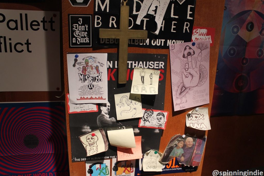 Flyers and artwork on the wall at WXTJ, including some referencing old call sign (WTJX). Photo: J. Waits