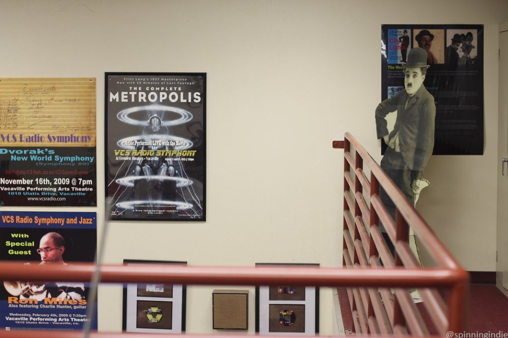 Posters and Charlie Chaplin upstairs at VCS Radio. Photo: J. Waits