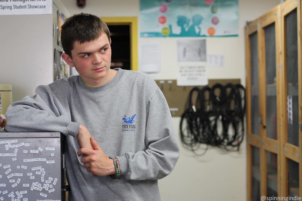 High school radio station KAKX's Student Manager Henry Thomas in lobby of station. Photo: J. Waits