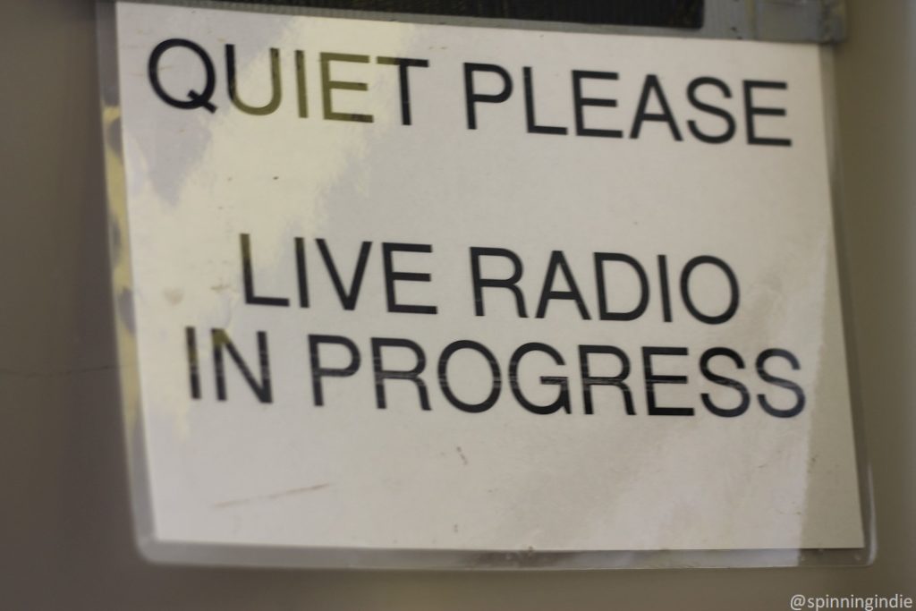 Sign on wall at KAKX: "Quiet Please! Live Radio in Progress." Photo: J. Waits