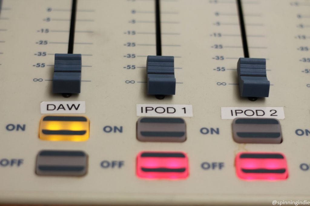 Sound board in KASB studio, with sliders marked iPod. Photo: J. Waits/Radio Survivor