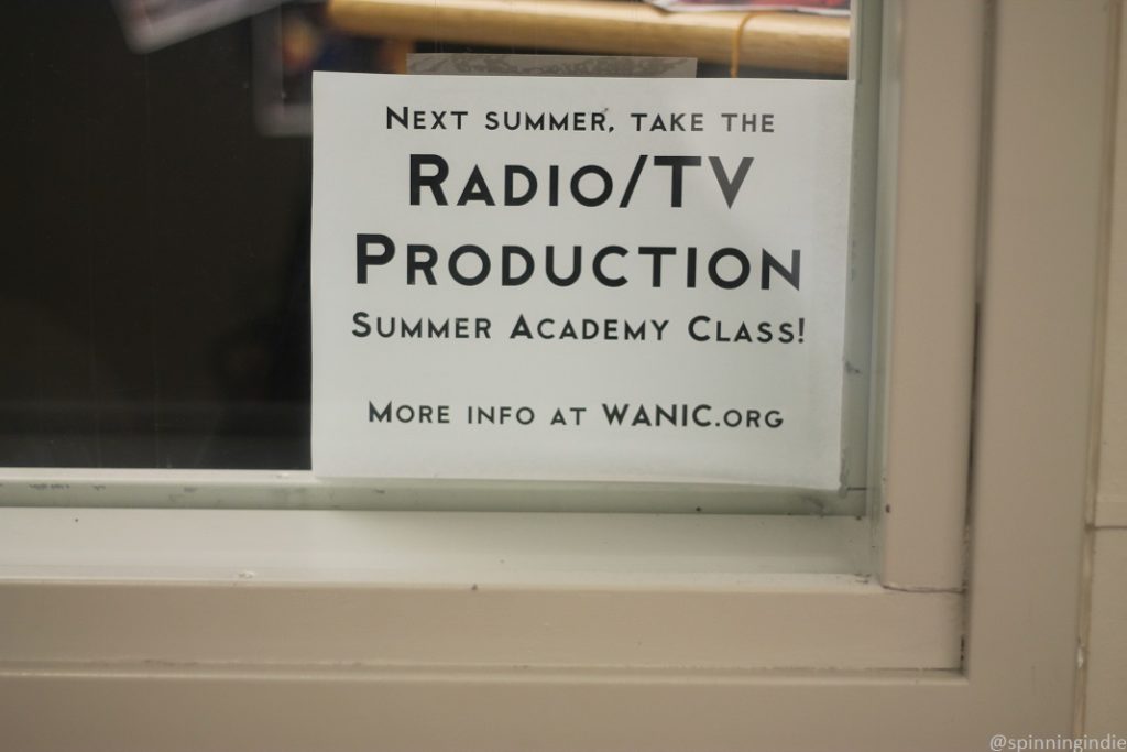 Sign for radio/TV production class in window of high school radio station KASB. Photo: J. Waits/Radio Survivor