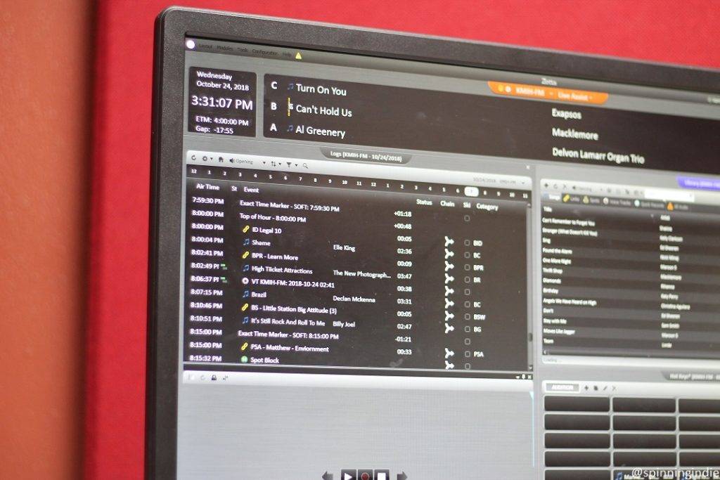 Radio automation display on a screen at high school radio station KMIH, showing track titles and production pieces. Photo: J. Waits/Radio Survivor