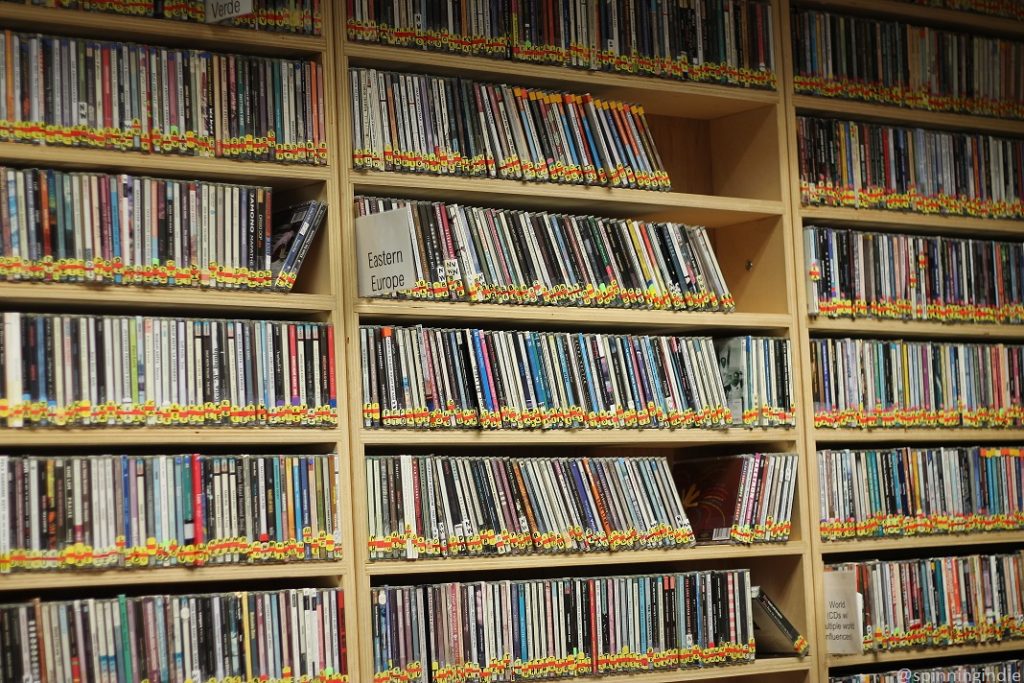 CDs on shelves in music library at KBCS, with "Eastern European" label in front of one section. Photo: J. Waits/Radio Survivor