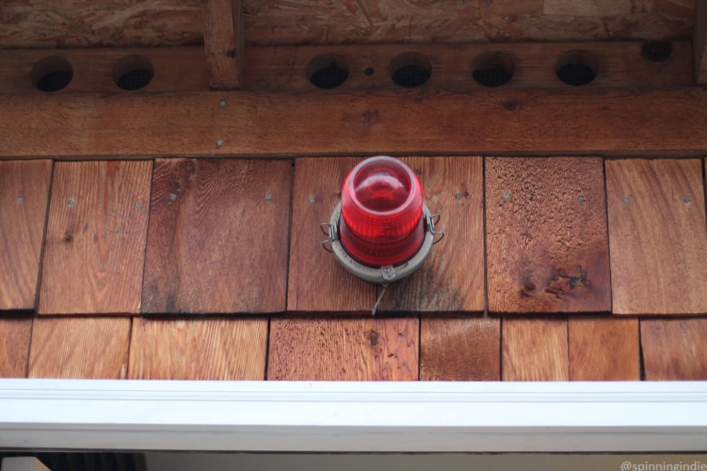 Red on-air light affixed to outside of KBFG's Shack. Photo: J. Waits/Radio Survivor