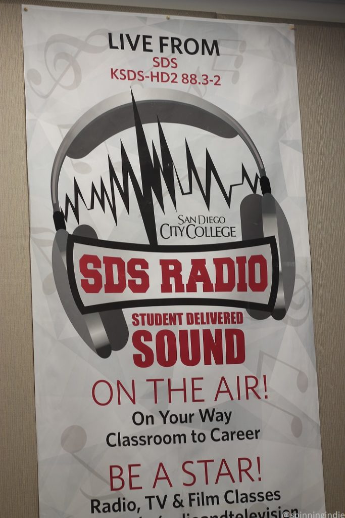 SDS Radio banner in SDS Radio Studio. Banner reads: "San Diego City College SDS Radio Student Delivered Sound on the Air! On Your Way Classroom to Career BE A STAR! Radio, TV & Film Classes..." Photo: J. Waits/Radio Survivor