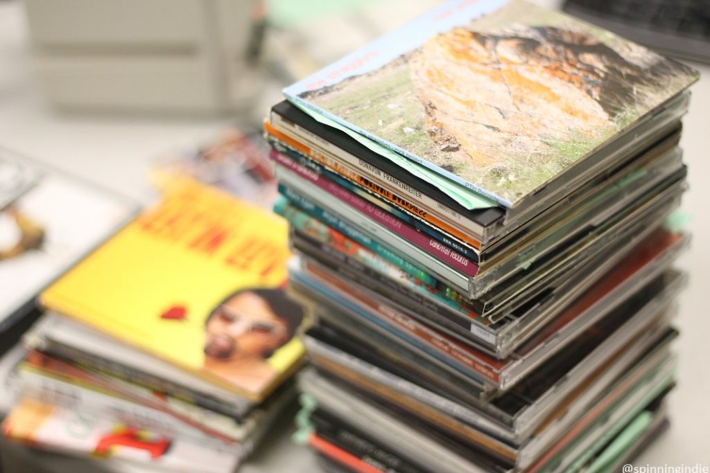 Stack of CDs at college radio station Griffin Radio. Photo: J. Waits/Radio Survivor