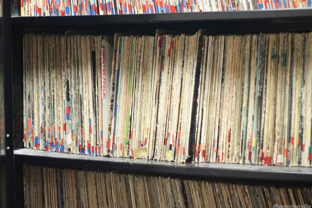 Shelves packed with vinyl LP records at college radio station KCR in 2019. Photo: J. Waits/Radio Survivor
