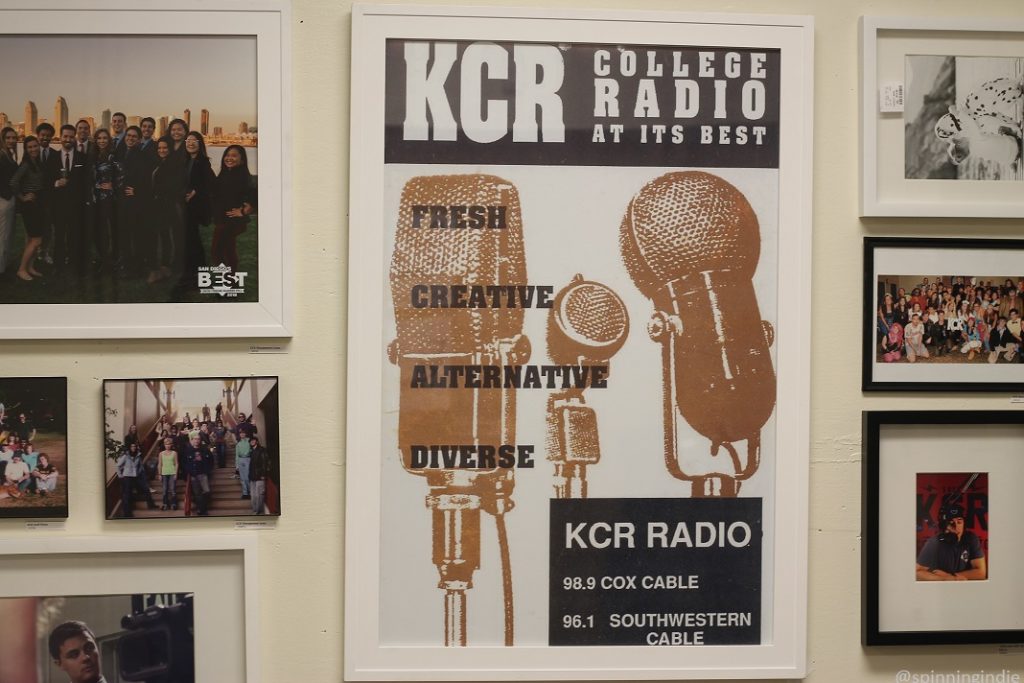 Posters and photos on wall at KCR College Radio. Poster in center reads: "KCR College Radio at its best. Fresh. Creative. Alternative. Diverse. KCR Radio 98.9 Cox Cable 96.1 Southwestern Cable." Photo: J. Waits/Radio Survivor