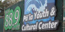 Sign at community radio station RadiOpio reads: "88.9 KOPO-LP Pa'ia Youth & Cultural Center" and has image of wave. Photo: J. Waits/Radio Survivor