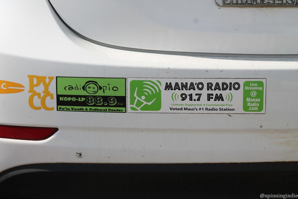 Radio station stickers spotted in the PYCC parking lot. Pictured: RadiOpio and Mana'o Radio stickers on a car bumper. Photo: J. Waits/Radio Survivor