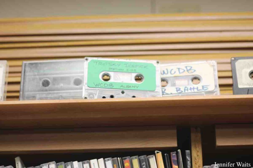 Cassette tapes atop shelves of CDs at college radio station WCDB. Photo: J. Waits
