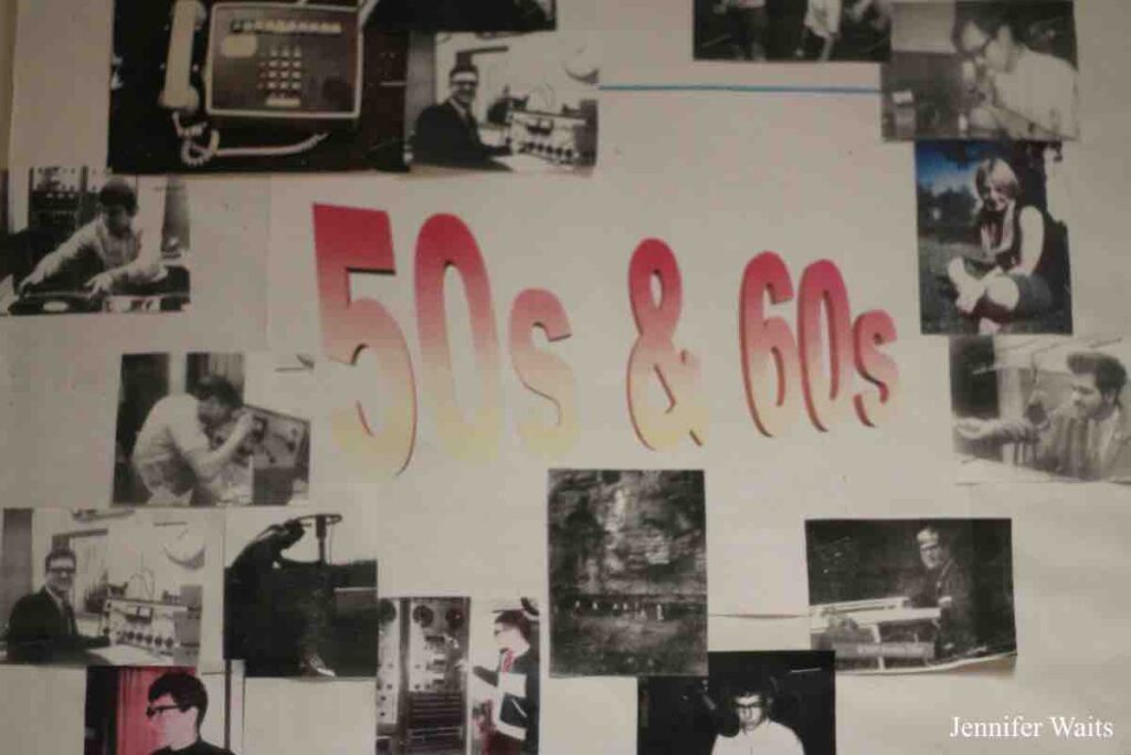 Wall display at WPRI. 50s and 60s written at center. Black and white vintage photos encircle those dates. Photo: J. Waits