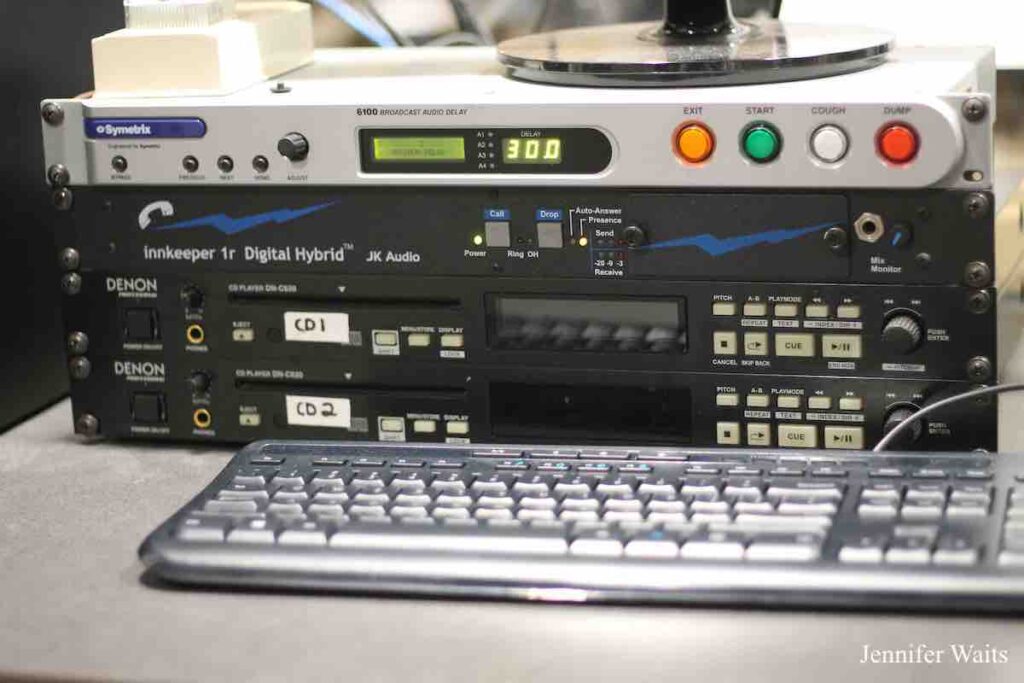 Photo of audio equipment in college radio station WRUC. Delay module on top, 2 CD players, and a computer keyboard. Photo: J. Waits