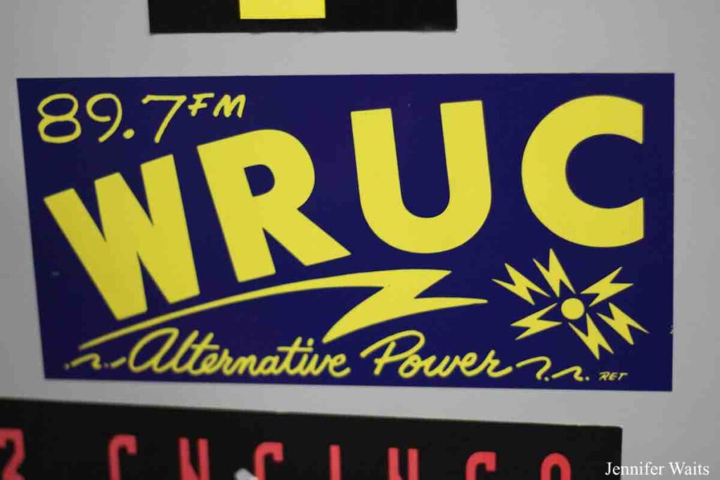 Photo of blue and yellow sticker college radio station sticker that reads: "89.7 FM WRUC Alternative Power." Photo: J. Waits