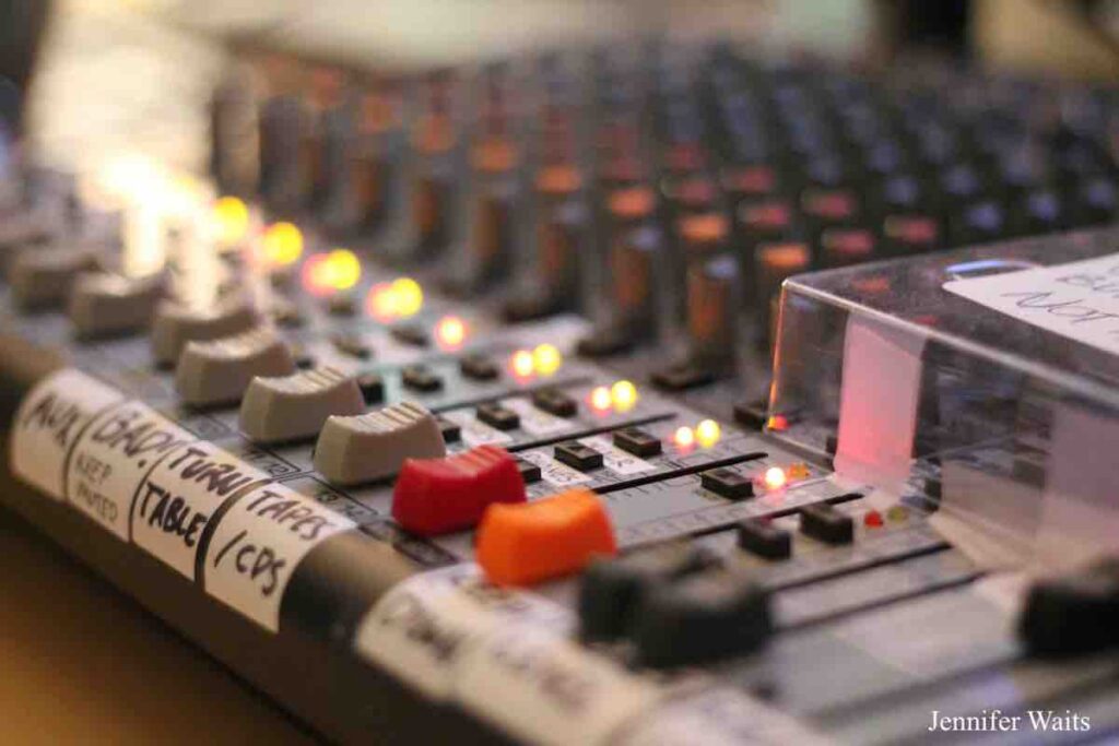 Photo of board at college radio station WXBC. Labels on tape read aus, bad, turn table, tapes/CDs. Photo: J. Waits