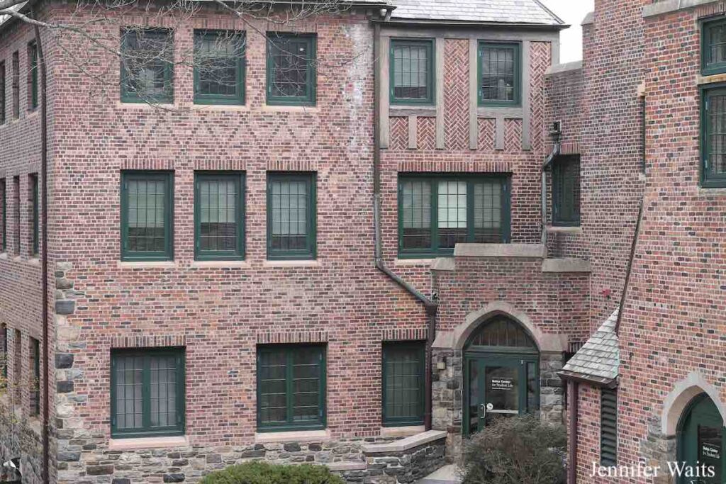 Photo of Bates Hall at Sarah Lawrence College. Old brick building with several stories and stone detailing. Photo: J. Waits