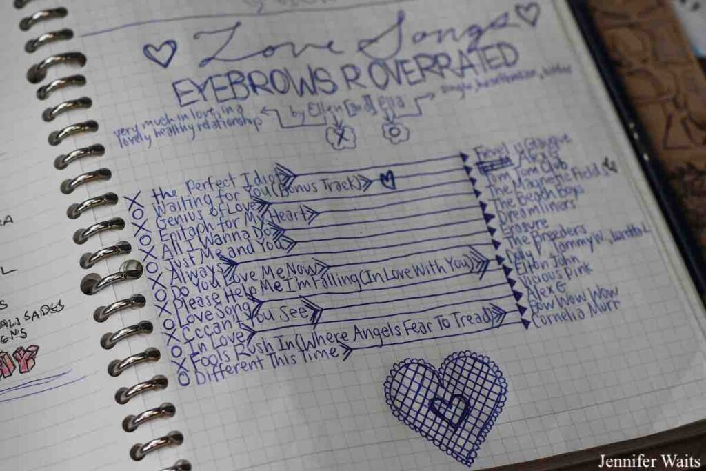 Photo of DJ log book at college radio station WSLC. Pictured is a notebook with handwritten playlist for Eyebrows Overrated show. Heart is drawn below the list of songs. Photo: J. Waits