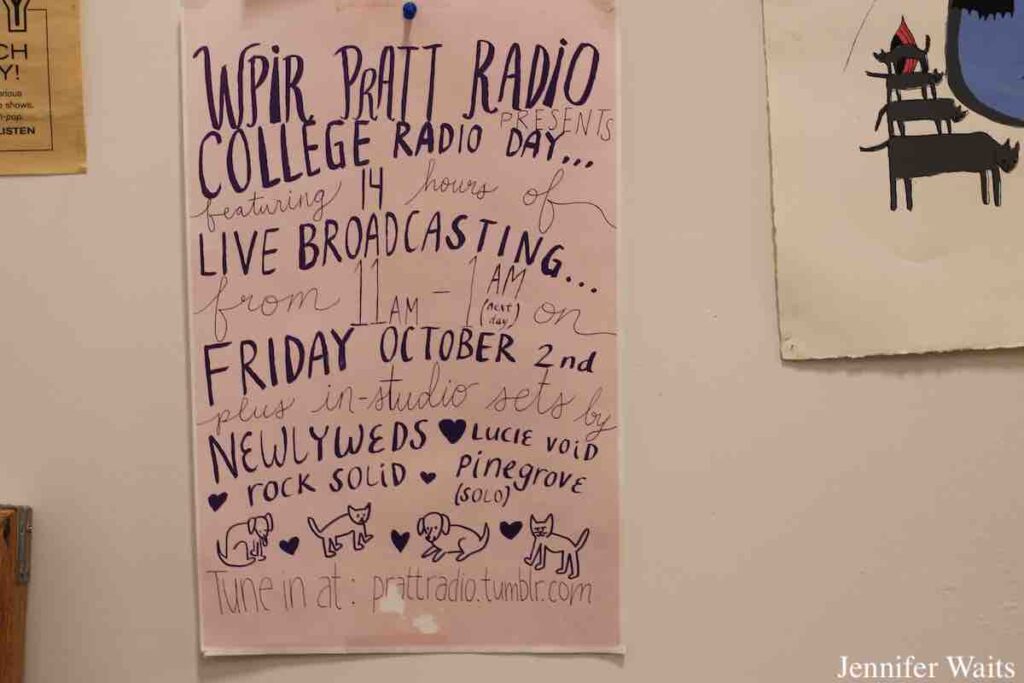 Old College Radio Day Broadcast flyer on wall at WPIR Pratt Radio in March, 2023. Photo: J. Waits