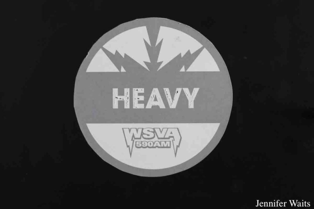 WSVA sticker circa 2007. A series of these stickers referencing different music genres are posted on cabinets at the college radio station. This one says HEAVY WSVA 590AM. March, 2023 photo by J. Waits