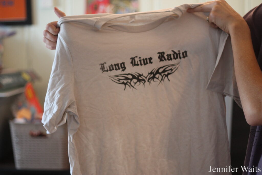Photo of t-shirt that reads "Long Live Radio." Photo taken by Jennifer Waits at college radio station WYBCx at Yale University in September 2025.