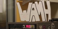 Radio Station Visit #199: WAMH-FM at Amherst College Photo of WAMH sign perched atop audio equipment in the Amherst College radio station WAMH. Photo: J. Waits