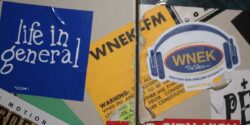 Photo of metal cabinet covered with stickers, including several for WNEK, the college radio station at Western New England College. Photo: J. Waits