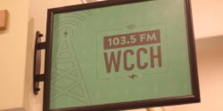 Radio Station Visit #202: WCCH-FM at Holyoke Community College Photo of green sign attached to a wall that reads 103.5 FM WCCH at the Holyoke Community College radio station. Photo: J. Waits